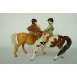 A Beswick figure of "Boy on Pony" with palomino colourway, printed factory marks in black, 14.