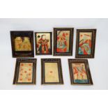 A set of five 19th century paper mâché card trays, each painted on a black ground with the King,