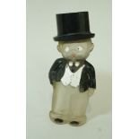 An Art Deco perfume bottle in the form of a man in a top hat and waist coat