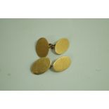 A pair of 9 carat gold oval panel cufflinks, by Deakin & Francis, Birmingham 1915, 8.