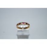 A diamond and ruby half hoop ring,