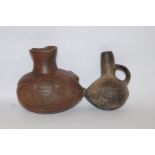 A Peruvian black pottery vessel, the bulbous body with circular textured surface,