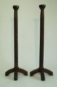 A pair of Arts and Crafts style candlestands,