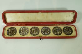A set of four silver buttons, by L. Emmanuel, Birmingham 1906, of open work foliate design, 2.