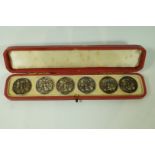 A set of four silver buttons, by L. Emmanuel, Birmingham 1906, of open work foliate design, 2.