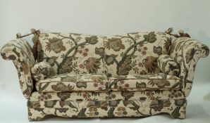 A late 20th century Knowle three seat sofa with loose cushions,