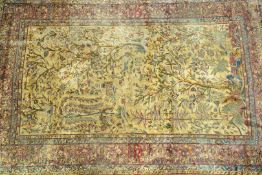 A Persian silk rug, woven with birds, animals, flowering trees and a temple on a yellow ground,
