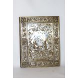 A late Victorian desk blotter the silver plated cover moulded and titled “Punch”,