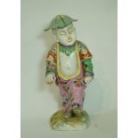 A 19th century continental porcelain figure of a nodding China man,