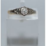 A single stone diamond ring, stamped '18ct', with an illusion set brilliant cut of approximately 0.
