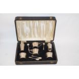 A six piece silver cruet set, by Adie Brothers, Birmingham 1945, in the Art Deco style,