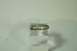 A diamond eternity ring, set with twenty six small old single cut stones,
