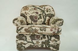 A late 20th century armchair with one loose seat cushion,
