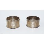 A pair of silver napkin rings, London 1942, of plain form,