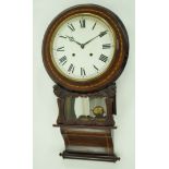 A Victorian rosewood wall clock, the painted round dial with cross banded frame, striking on a bell,