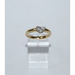 A diamond single stone ring, the heart shaped stone calculated as weighing approximately 0.