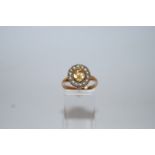 A Victorian gem and pearl set ring, the oval cut stone enclosed by fourteen split pearls,