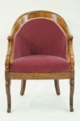 An early 19th century continental rosewood tub shaped chair,