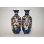 A pair of Japanese cloisonne vases, each with lancet panels depicting dragons and birds,