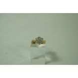 A seven stone diamond cluster 18 carat gold ring, the brilliant cuts totalling approximately 0.