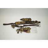 A heavy horse martingale with brass studs,