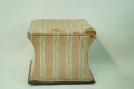 A Victorian square ottoman, with waisted sides on casters, 43cm high, 49cm wide,