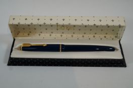 A Parker Junior (1950s) blue with 14ct gold medium nib made in Newhaven, press bar filling,
