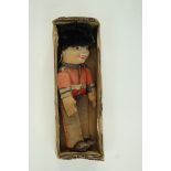 A Norah Wellings figure of a soldier wearing a bear skin,