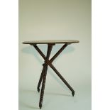 An unusual oak occasional table, with oval two plank top,