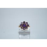 A 9ct gold nine stone amethyst  cluster ring, finger size M1/2, 3.