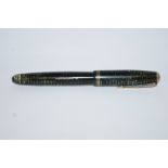 A Parker Vacumatic (1939) green stripe, Canadian with arrow nib, two thin gold bands to cap,