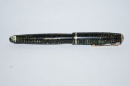 A Parker Vacumatic (1939) green stripe, Canadian with arrow nib, two thin gold bands to cap,