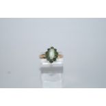 A 9 carat gold opal and emerald eleven stone cluster ring, finger size N,