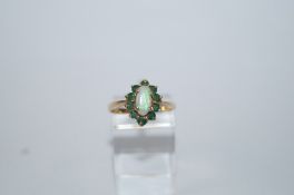 A 9 carat gold opal and emerald eleven stone cluster ring, finger size N,
