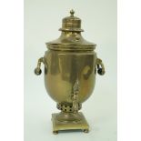 A brass two handled samovar on rectangular plinth with ball feet, 44.