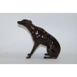 A 20th century bronze model of a seated greyhound,