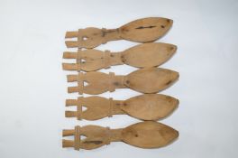 A set of five fruitwood carved Scandinavian spoons, each with carved crosshatch handles,