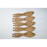 A set of five fruitwood carved Scandinavian spoons, each with carved crosshatch handles,