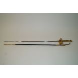 A 1930s honours sword, with brass hilt, engraved blade and leather and brass mounted scabbard,