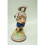 A late Victorian German bisque figure of a boy playing a musical instrument,