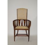 An early 20th mahogany Art Nouveau style armchair with half padded back seat on square tapering