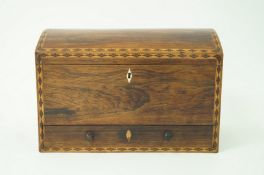 A Victorian rosewood dome top stationary box, with parquetry banding,