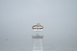 A single stone diamond ring, indistinctly stamped, the brilliant cut of approximately 0.