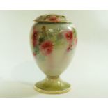 A 19th century pottery vase and pierced cover painted with flowers, within gilt rims,
