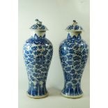 A pair of early 20th century Chinese vases and covers,