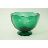 A green glass punch bowl, with flared foot,