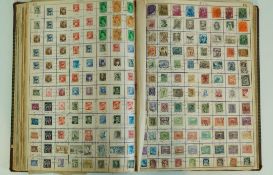 A large early 20th century account book, converted into a stamp album,