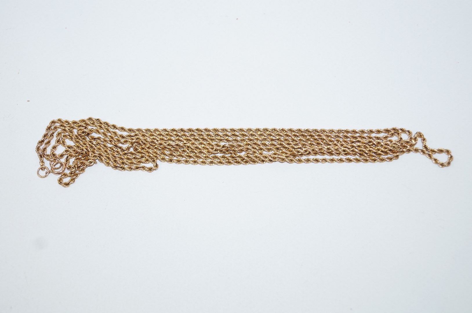 A guard chain, of rope links, unmarked, 144 cm long, 27.