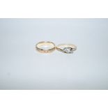 A three stone diamond ring, the small brilliant cut and two single cuts to an unmarked mount,