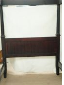 A 21st century stained pine four poster bed with turned uprights,